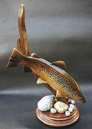 Brown Trout mounted on a piece of driftwood
Note: The carved rocks and driftwood base give this carving the appearance of swimming to the bottom of a pond or brook.