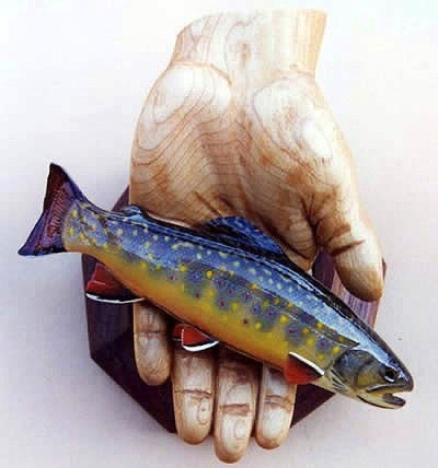 Hand of a small boy holding a Brook Parr, mounted on a Walnut Base.

Note: This piece was inspired, by my then 6 year old son, proudly showing off the first fish he caught all by himself.