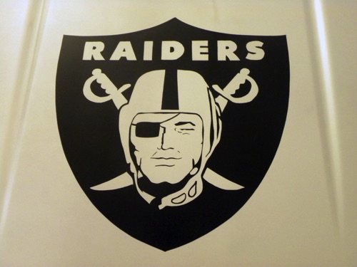 Raiders logo on the hood of a Chevy truck.