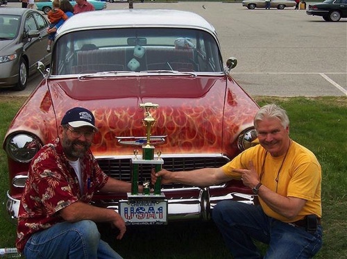 Michael Lowell on the left, proud owner of the 55 Chevy, and a trophy for best 1950's vintage antique car at the 2008 Bonny Eagle car show. Artist Gene Bahr on the right.

Pic. 3 of 3