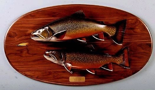 2 Brook Trout chasing a fly. Mounted on a Walnut panel.